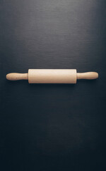 Baking background with flour, eggs, kitchen tools, utensils  on dark table. Top view. Flat lay style. Mock up.