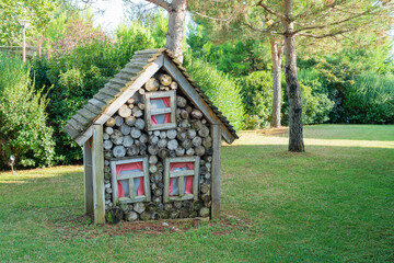 decorative house made of firewood in the park
