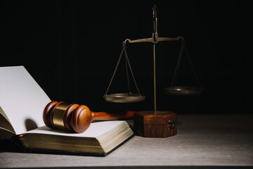 Justice and law concept.Male judge in a courtroom with the gavel, working with, computer and...