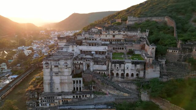 Aerial view of Garh Palace situated in Bundi town, Rajasthan state in India shot during sunset time.