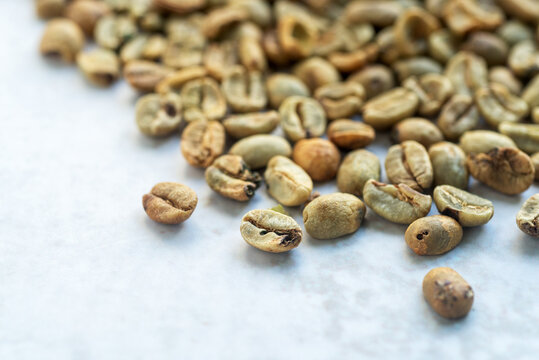 A Pile Of Green Bean Coffee Defect On Marble Background