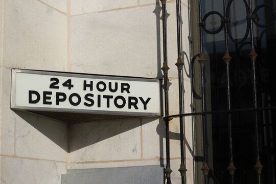 Sign that state 24 hour depository at the local bank.