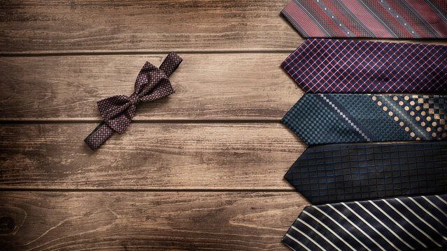Neckties. Set different neckties. Colored tie for men. Set of stylish men accessories, men's fashion. Collection of coiled neckties in display. Bow tie.