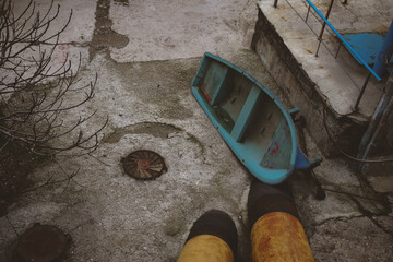 Blue boat lying on the ground