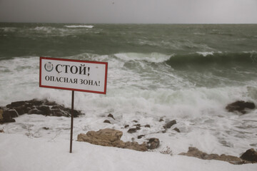 Stormy sea and snowy landscape