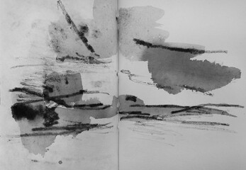 Abstract and expressive art. Closeup view of a modern non figurative black and white painting drawn in a notebook.
