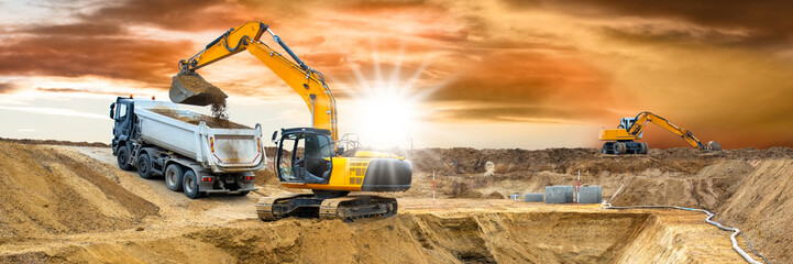  excavator is digging and loading at construction site