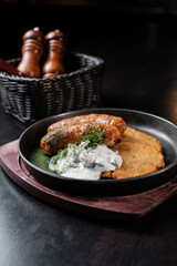Fried Bavarian sausages with potato pancakes