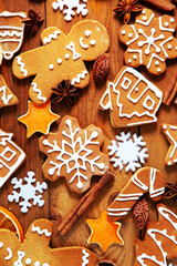 Christmas homemade gingerbread cookies on a wooden background.