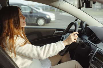 Fototapeta na wymiar Side view relaxed woman driving car, rent carshering concept. Sales concept