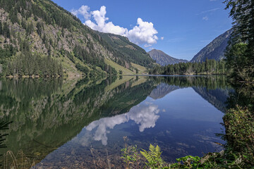 Fototapeta na wymiar Schwarzensee mountain lake in Solktaler Nature Park, Kleinsolker Obertal, the largest lake in the Niedere Tauren, Scladming, Styria, Austria