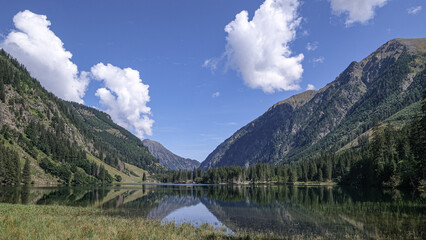 Fototapeta na wymiar Schwarzensee mountain lake in Solktaler Nature Park, Kleinsolker Obertal, the largest lake in the Niedere Tauren, Scladming, Styria, Austria