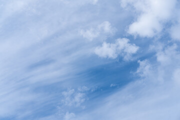 Beautiful sky background with picturesque cirrus clouds. Blue majestic sky with big pretty clouds. Clouds like wave.