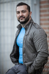 Natural looking guy posing outdoors, wearing casual clothes