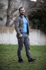 Obraz premium Natural looking guy posing outdoors, wearing casual clothes