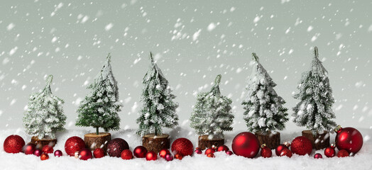 Christmas background in winter, snow landscape with falling snow flakes. Christmas trees with red Xmas decoration in row, panorama, banner with copy space