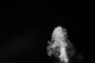 the movement of hot steam with water droplets is isolated on a black background to overlay your photos. Steam background, abstract smoke on a black background.