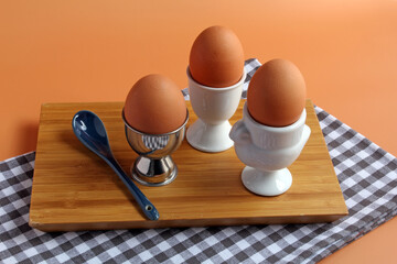A trio of soft boiled eggs.