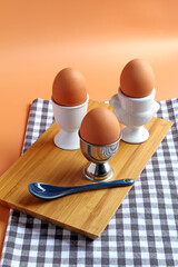 A trio of soft boiled eggs.