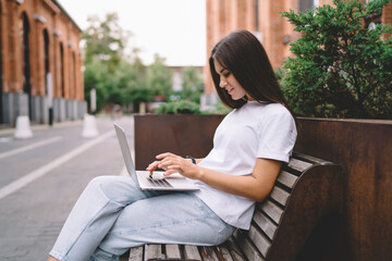 Young female freelancer working on laptop