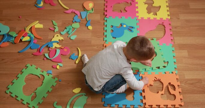 child playing with Foam Puzzle Mat Learning ABC Alphabet Study