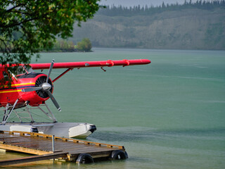 Red seaplane float plane after a thunderstorm in the town of Whitehorse in the yukon territory used for travel to remote locations