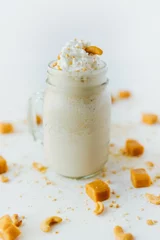 Raamstickers Vertical shot of refreshing caramel milkshake © Jeffrey Bethers/Wirestock Creators