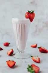 Meubelstickers Vertical shot of refreshing strawberry milkshake © Jeffrey Bethers/Wirestock Creators