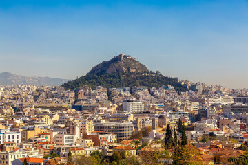 Residential Homes in a Historic City with Cityscape and Mountains. Areopagus Hill, Athens, Greece.