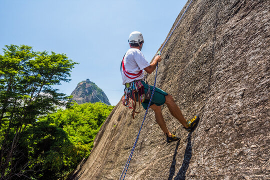 Man rock climbing Morro da Urca, Rio de Janeiro, Brazil