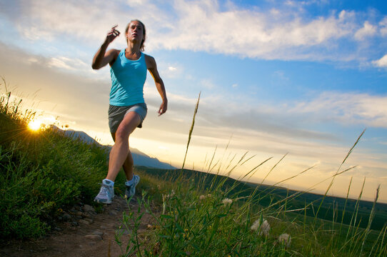 A woman trail running near Boulder, CO.