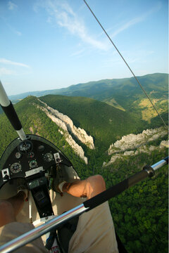 An ultralight trike flies over the dual Tuscarora fins and the Via Ferrata at Nelson Rocks Preserve near Circleville, WV.