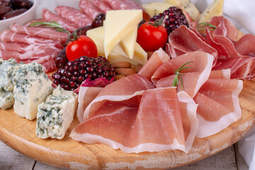 Appetizers table with different antipasti, charcuterie, snacks and cheese. Buffet party. 