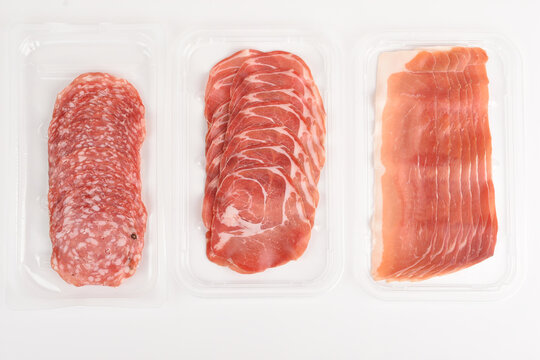 Vacuum packed, different types, sausage Prosciutto salami set, Isolated on white background
