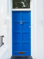 Brightly coloured traditional English house door in London