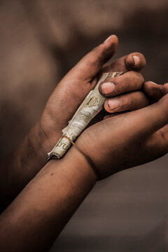 Child's hands with Chinese Yuan.