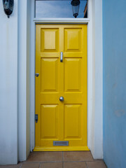 Brightly coloured traditional English house door in London