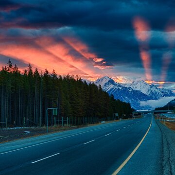 Highway, mountains and forest, sunrise