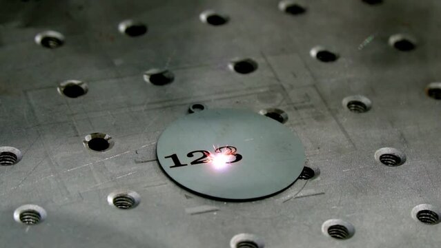 Industrial production of engraving with a modern laser. additive manufacturing metal printer printing model - close up view, slow motion. Prototyping, metalworking, engraving, futuristic,	