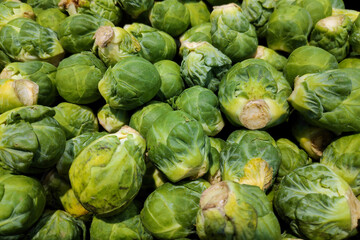 Fototapeta na wymiar Stack of brussels sprouts on a market stall