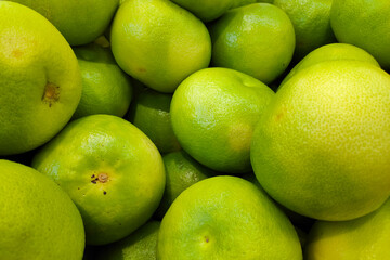 Stack of Pomelos on a market stall