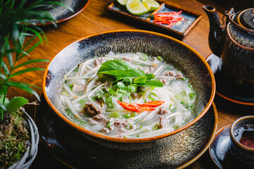 photo of traditional Vietnamese noodle soup consisting of noodles, beef and broth.