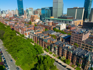 Boston Back Bay historic townhouses on Commonwealth Avenue with modern city skyline at the...