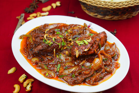 Chicken karahi korma masala with bread served in karahi isolated on table top view of indian, pakistani and punjabi spicy food