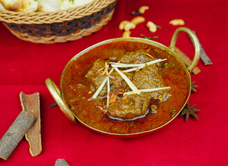Beef Bhuna korma masala rogan gosht with bread served in karahi isolated on table top view of indian, pakistani and punjabi spicy food