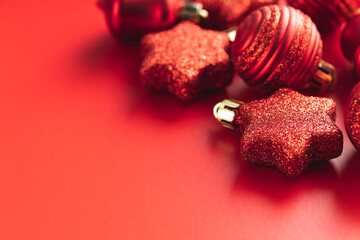 Red christmas decoration. Christmas bulbs on red background.
