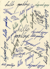 The words 'hello' and 'goodbye' written on with ink on a piece of ecru colored handmade  paper.