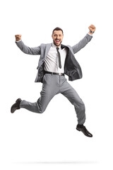 Excited young businessman in a grey suit jumping