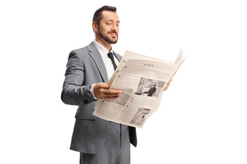 Businessman in a grey suit reading a newspaper