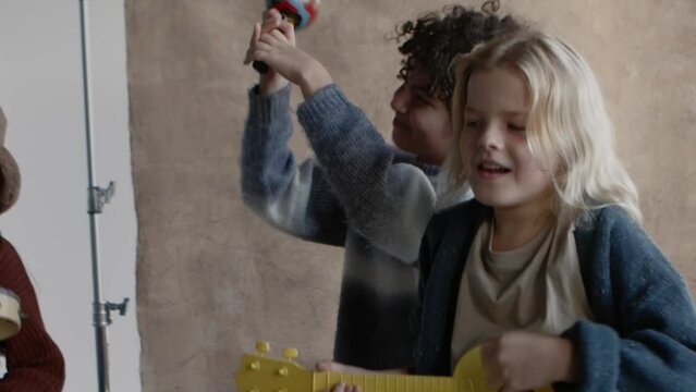 a group of children playing music together in a band